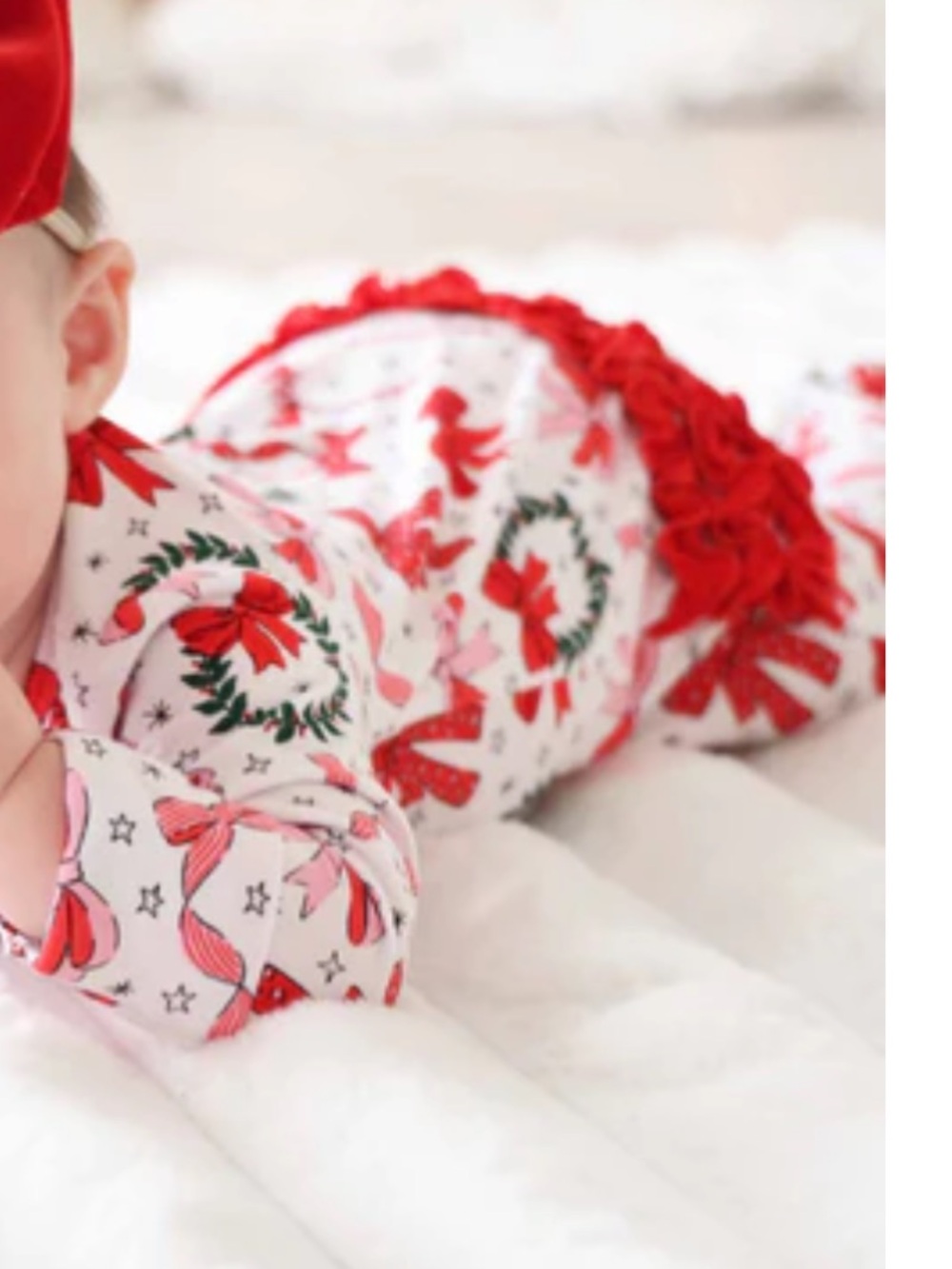 Caden Lane wrapped in a bow footie